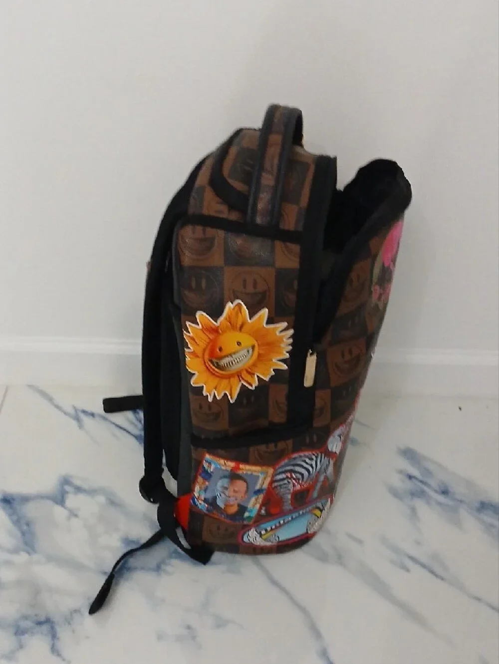 Sprayground Brown Checkerboard Backpack with Multicolor Sticker Graphics